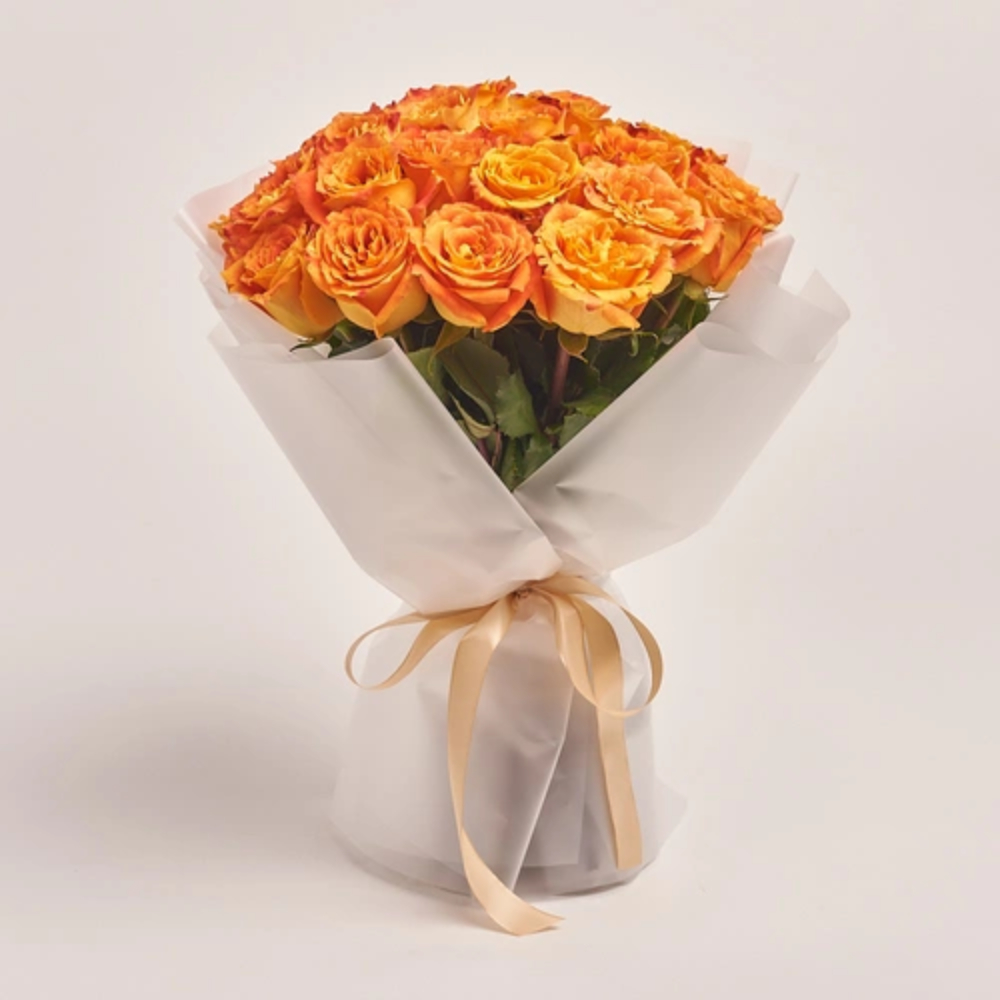Orange rose bouquet wrapped in white paper with a soft beige ribbon