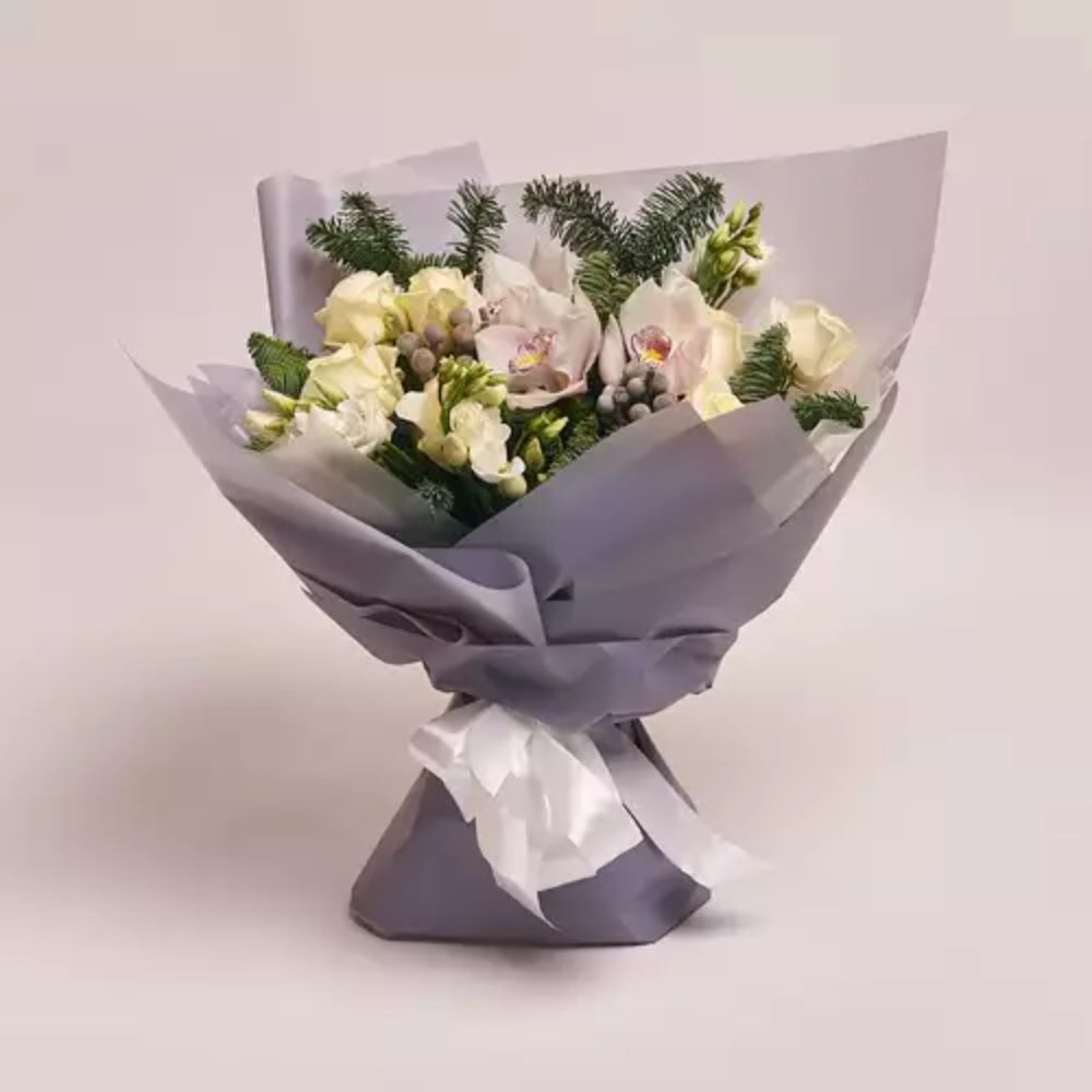 Elegant white and cream flower bouquet with greenery, wrapped in grey paper and tied with a white ribbon