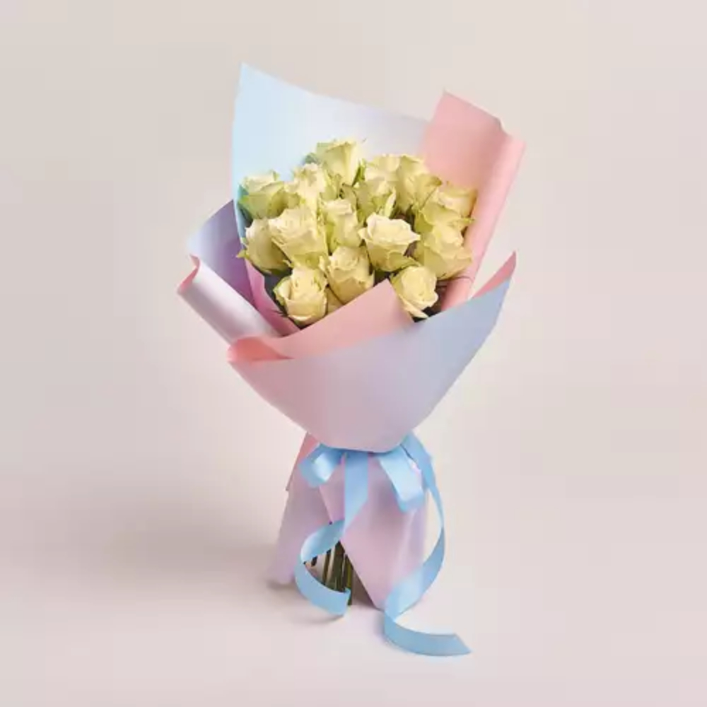 Fresh pink roses bouquet wrapped in elegant pastel pink paper with a soft blue ribbon, perfect for romantic gifts, birthdays, and special occasions.