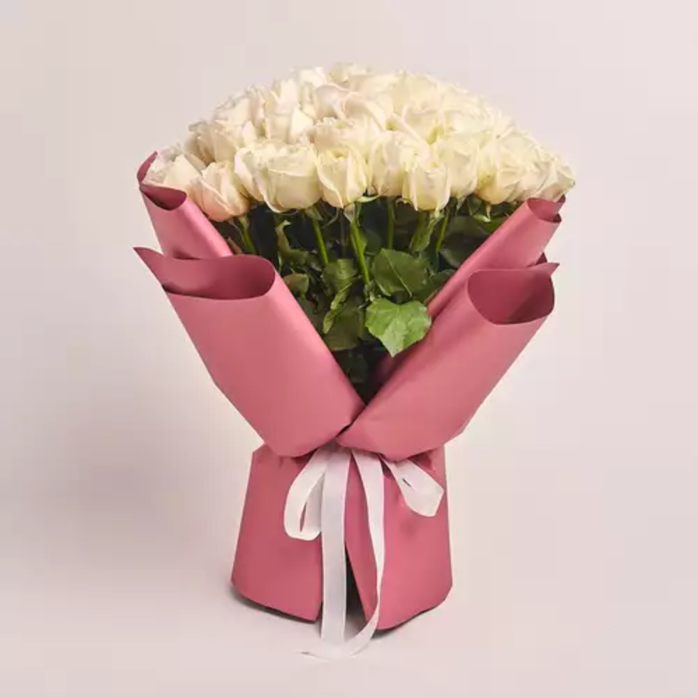 Elegant bouquet of fresh pink roses wrapped in premium pastel paper with a soft ribbon, perfect for romantic gifting, anniversaries, and special occasions in Dubai.