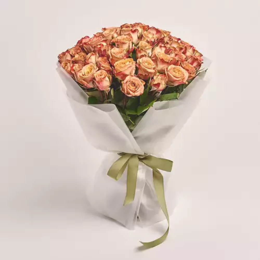 Elegant bouquet of fresh pink roses wrapped in premium pastel paper with a soft ribbon, perfect for romantic gifting, anniversaries, and special occasions in Dubai.