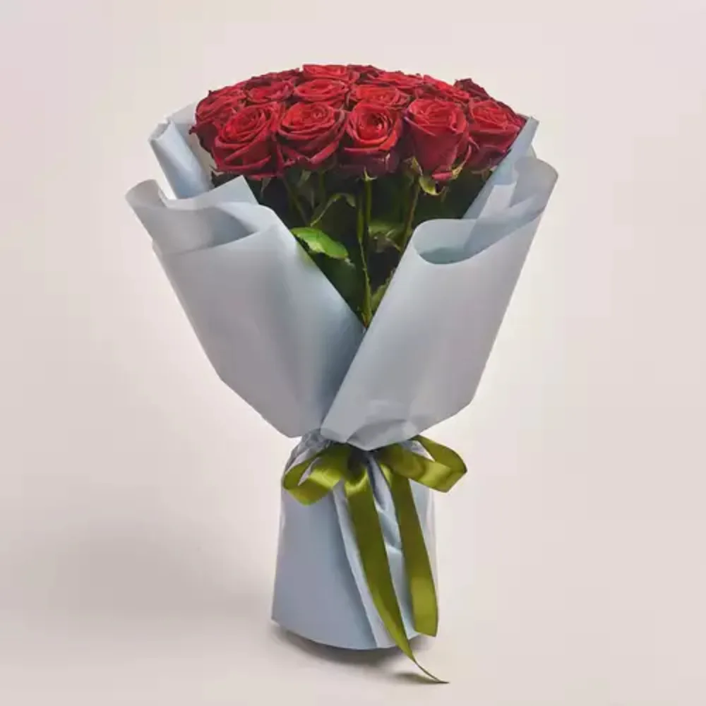 Elegant bouquet of fresh pink roses wrapped in soft pastel paper with premium finishing and a delicate ribbon, perfect for romantic gifting and special occasions in Dubai.