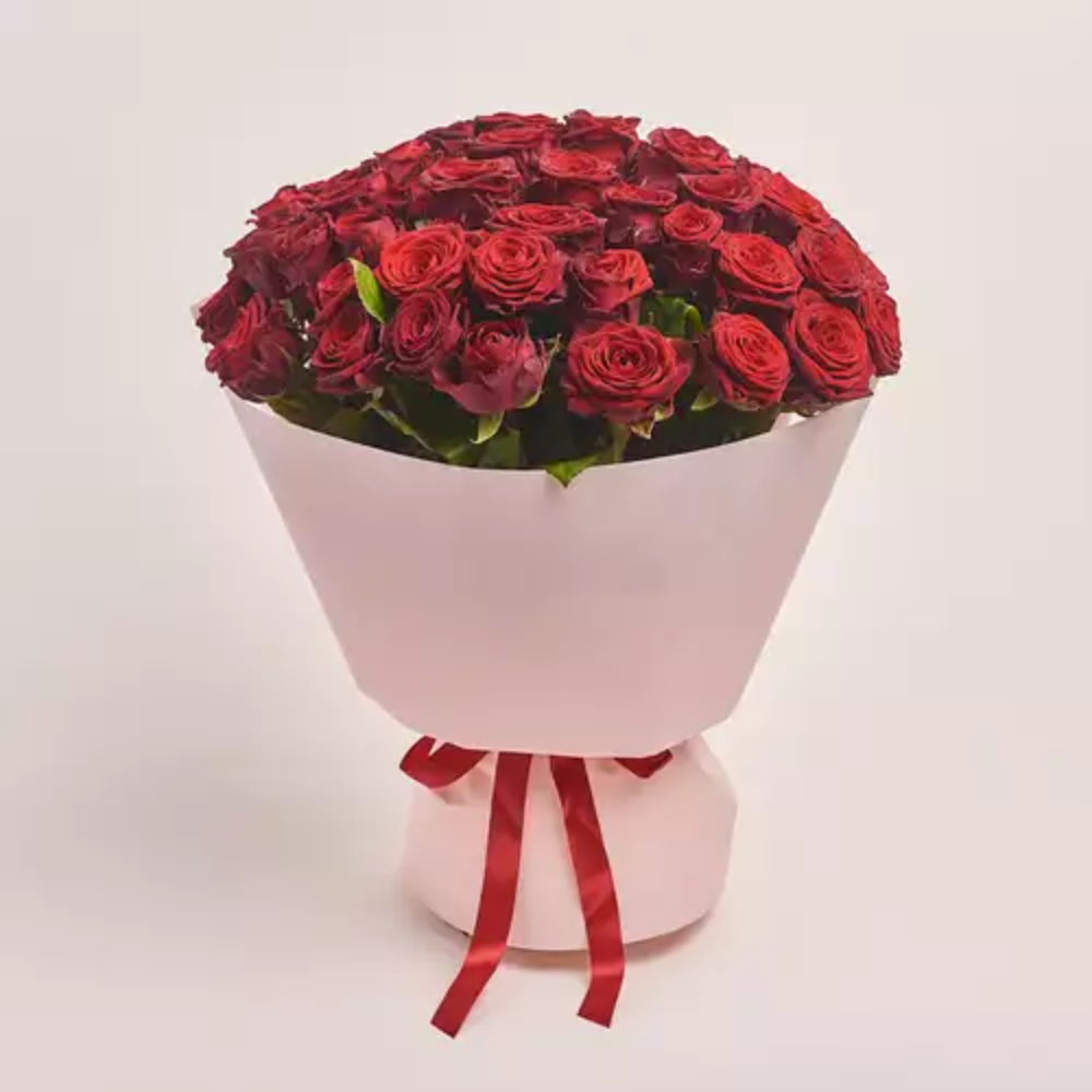 Luxury bouquet of fresh red roses wrapped in elegant white paper with a red ribbon, perfect for romantic gifts, anniversaries, and special occasions.