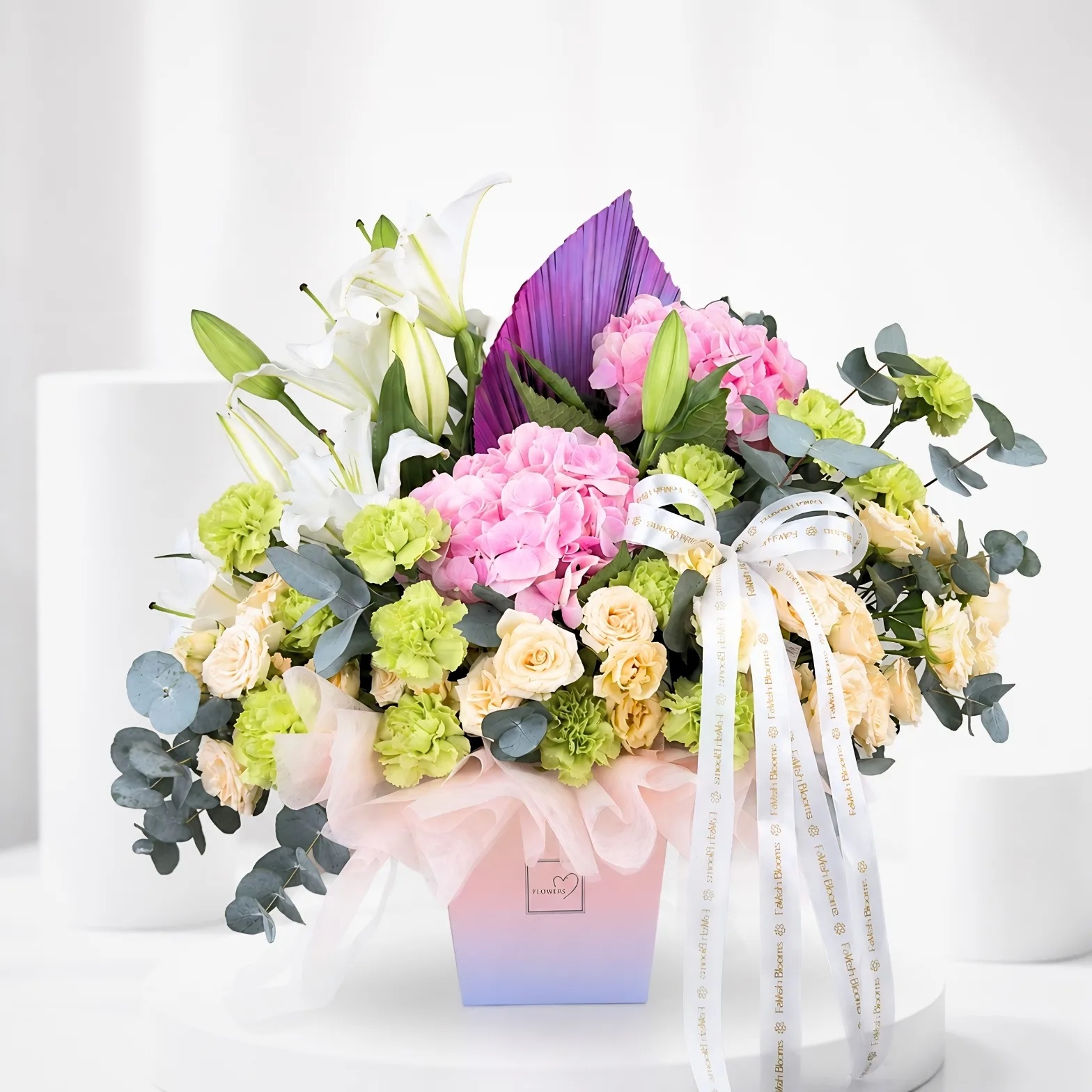 Elegant grand opening flower arrangement with pink hydrangeas, white lilies, and cream roses in a luxury pastel box.