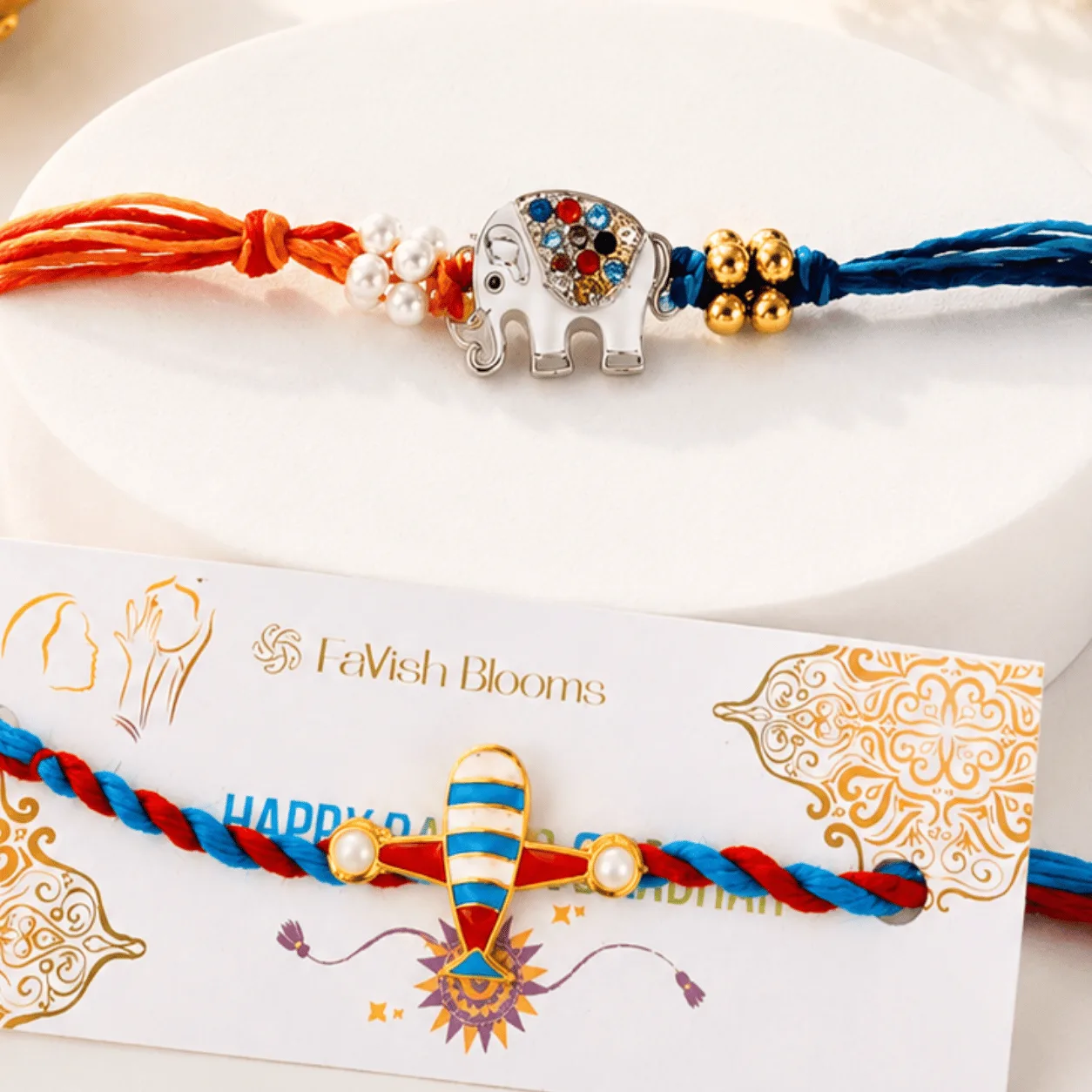 Colourful kids Rakhi set with aeroplane and elephant designs, perfect for little brothers.