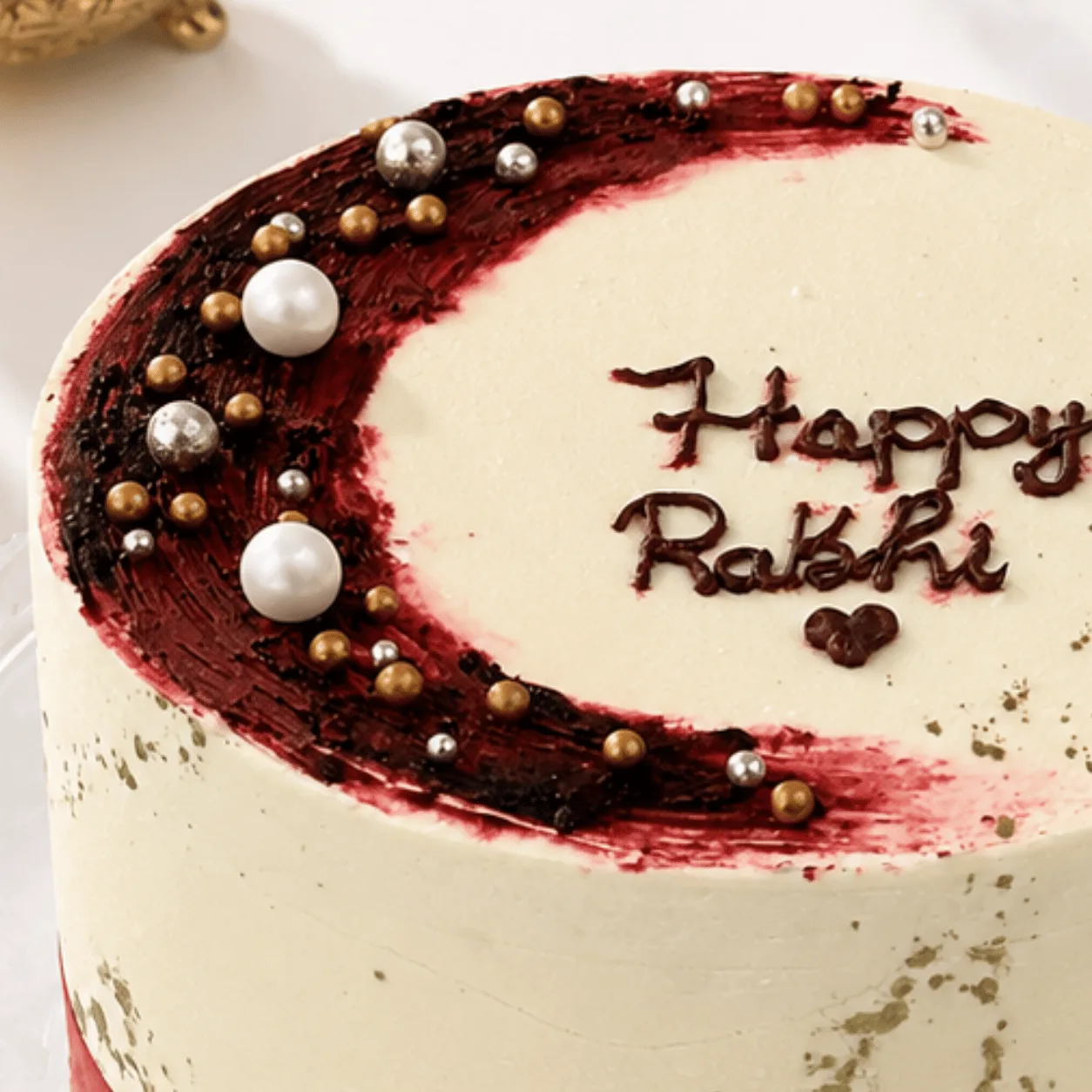 Happy Rakhi cake with red velvet sponge and creamy frosting