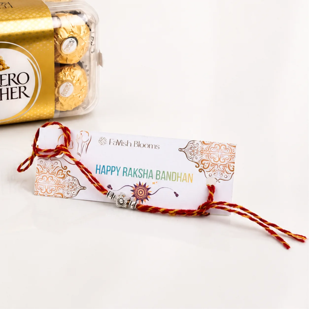 Elegant Silver Floral Bead Rakhi and Ferrero Rocher Chocolate Box – Rakhi Gift Delivery UAE