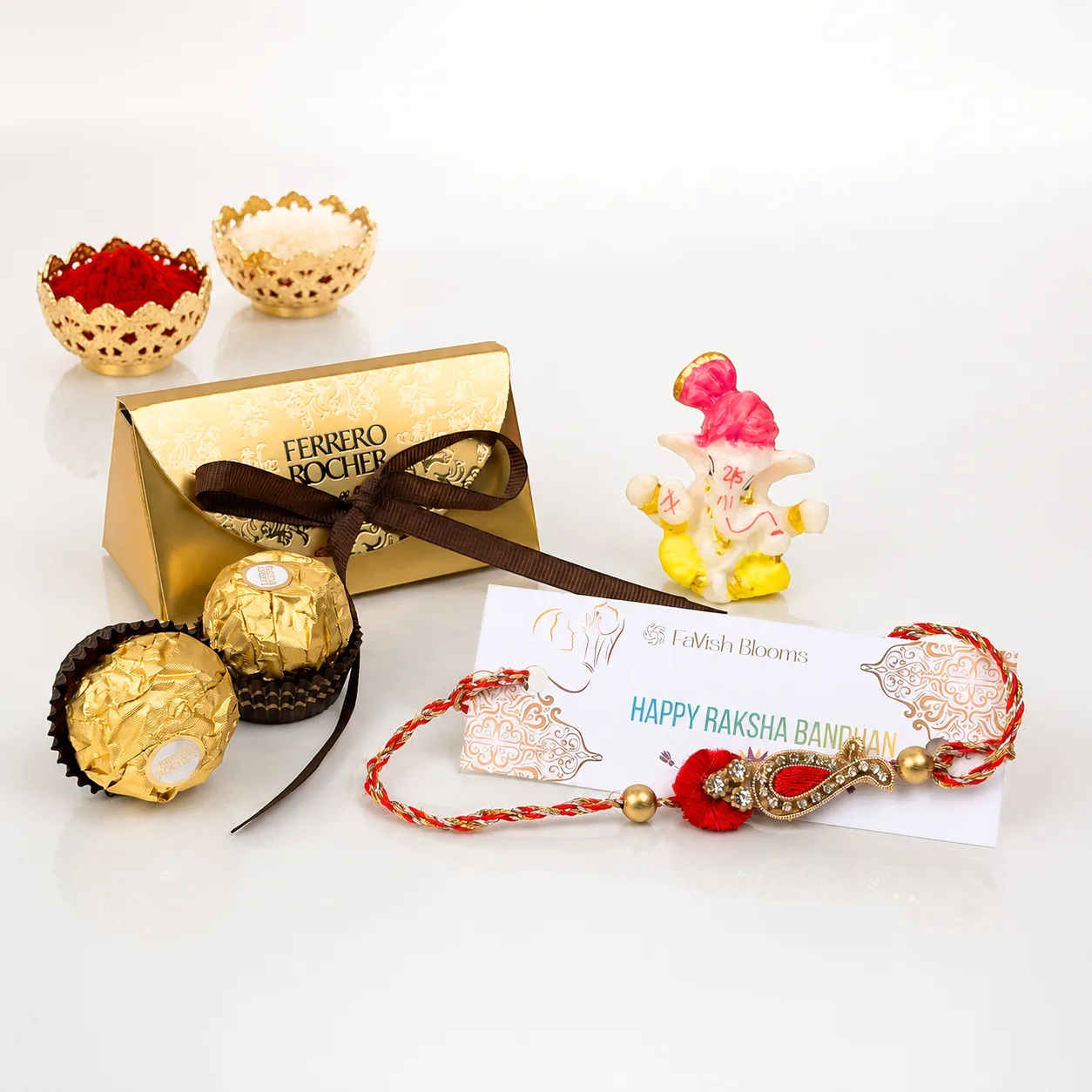 Paisley Rakhi with Ferrero Rocher chocolates and Ganesha idol gift set