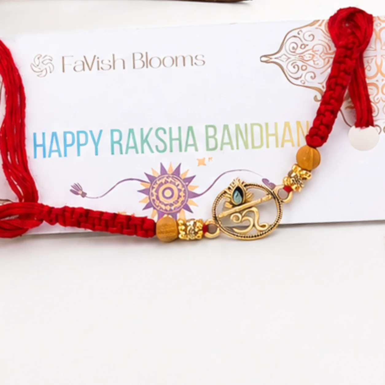 Elegant Om Rakhi with Ferrero Rocher box and festive accessories