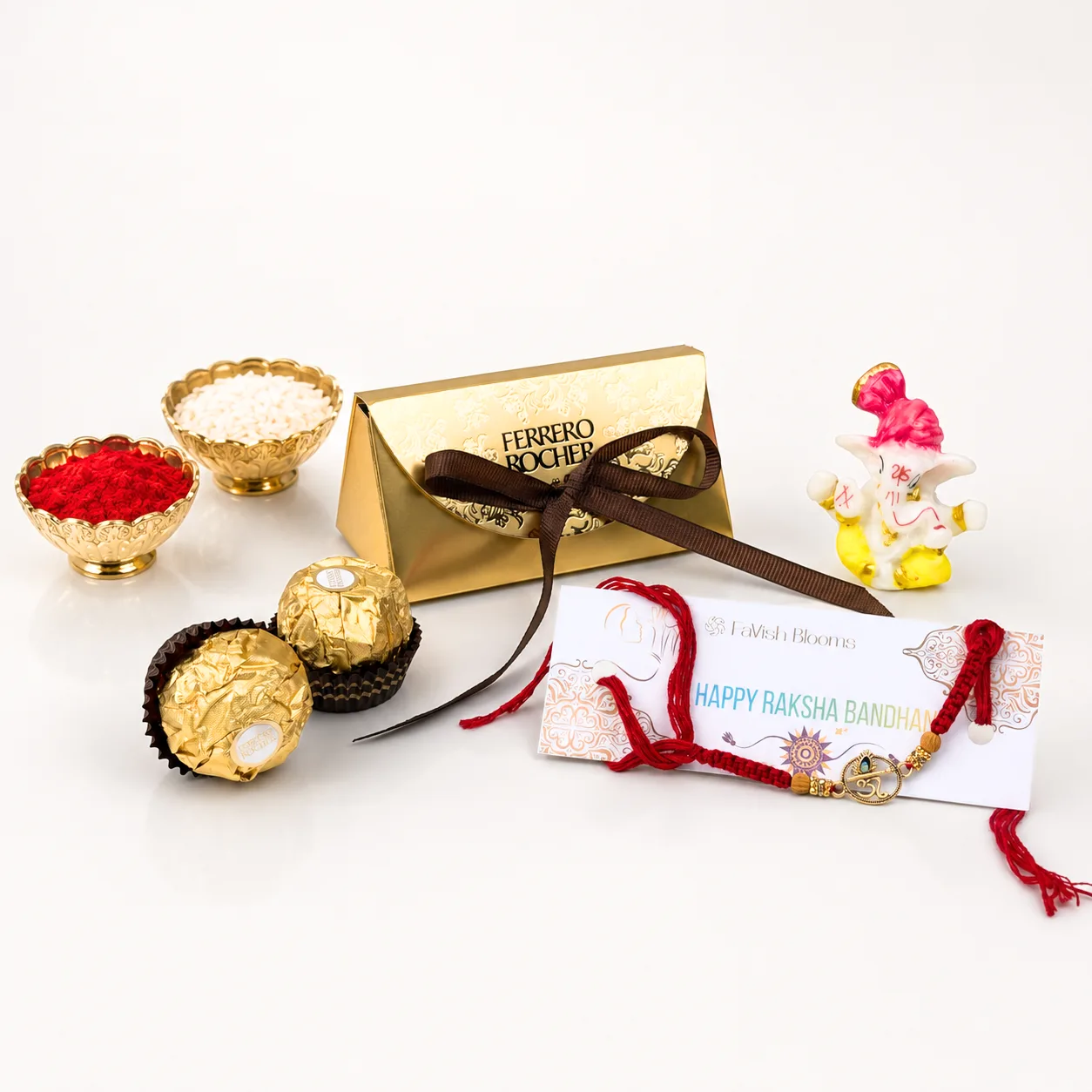 Om Rakhi with traditional sweets and festive roli chawal for brother