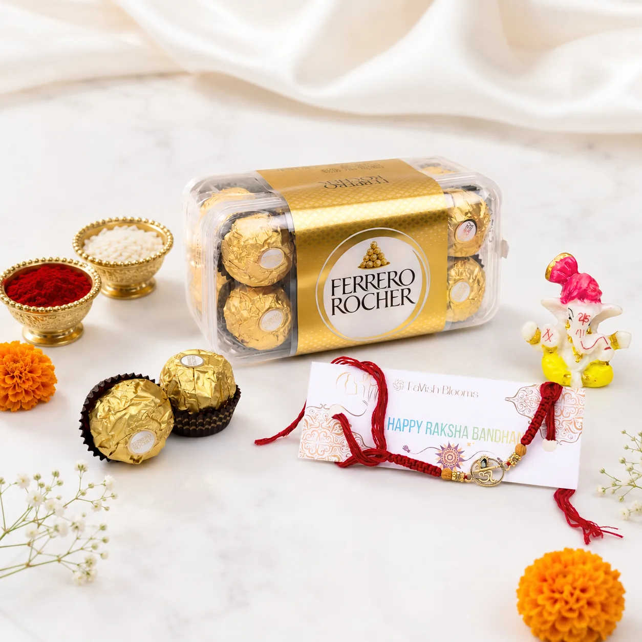 Om Rakhi Blessings and Chocolate Gift Set with Ferrero Rocher, Ganesha idol, roli, chawal, and greeting card.