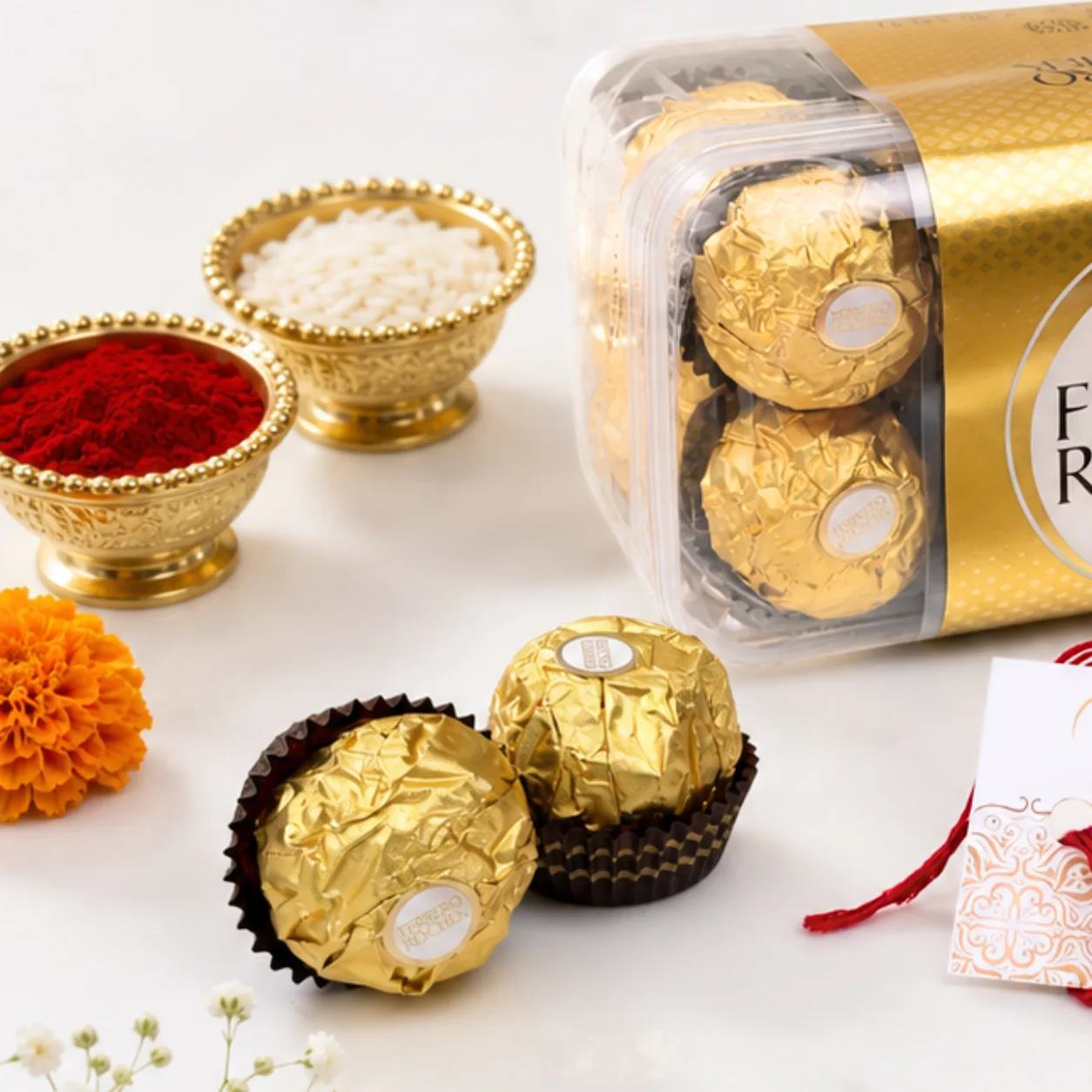 Close-up view of the golden Om Rakhi with decorative beads and traditional festive detailing.