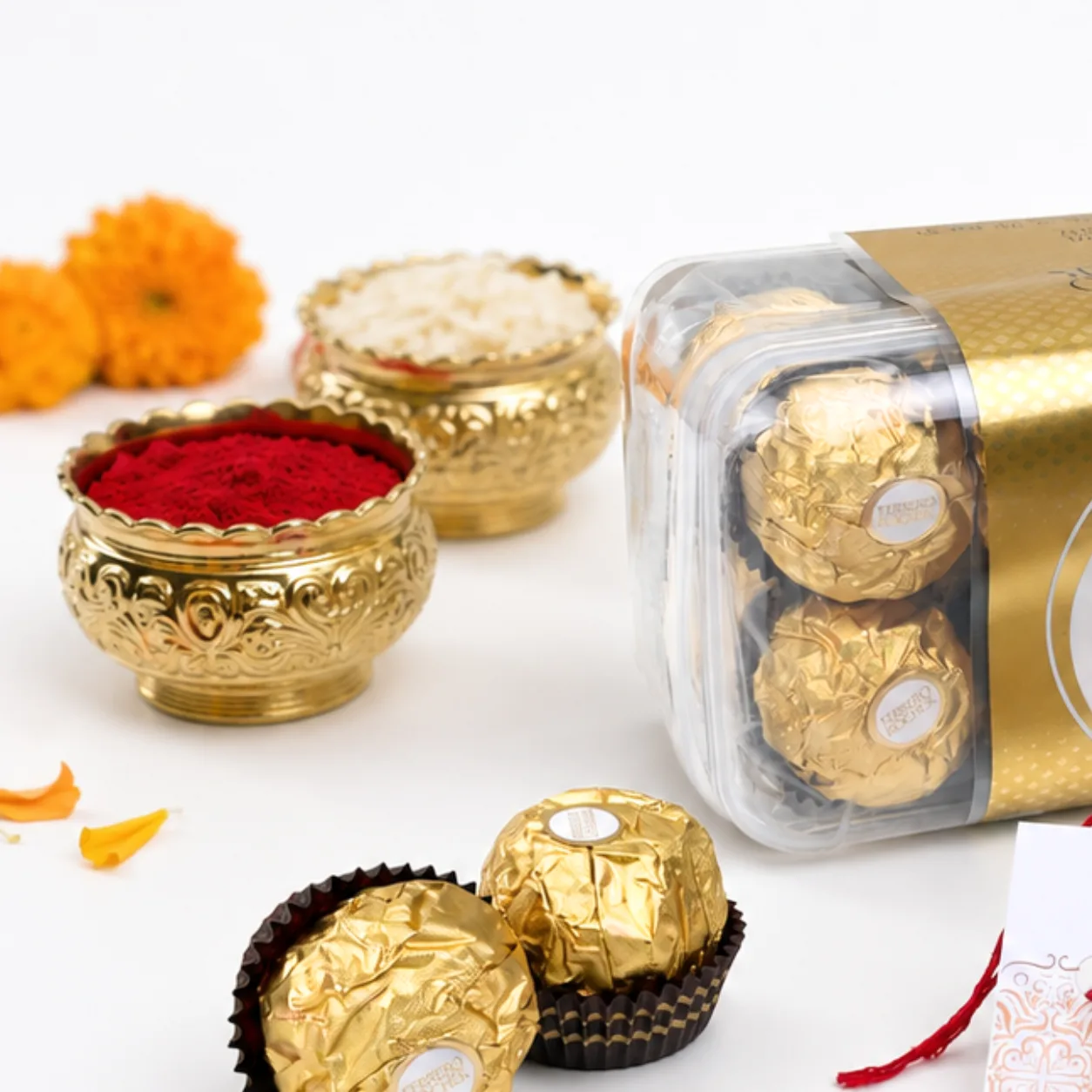 Ferrero Rocher 16-piece chocolate box paired with an Om Rakhi and festive accessories.