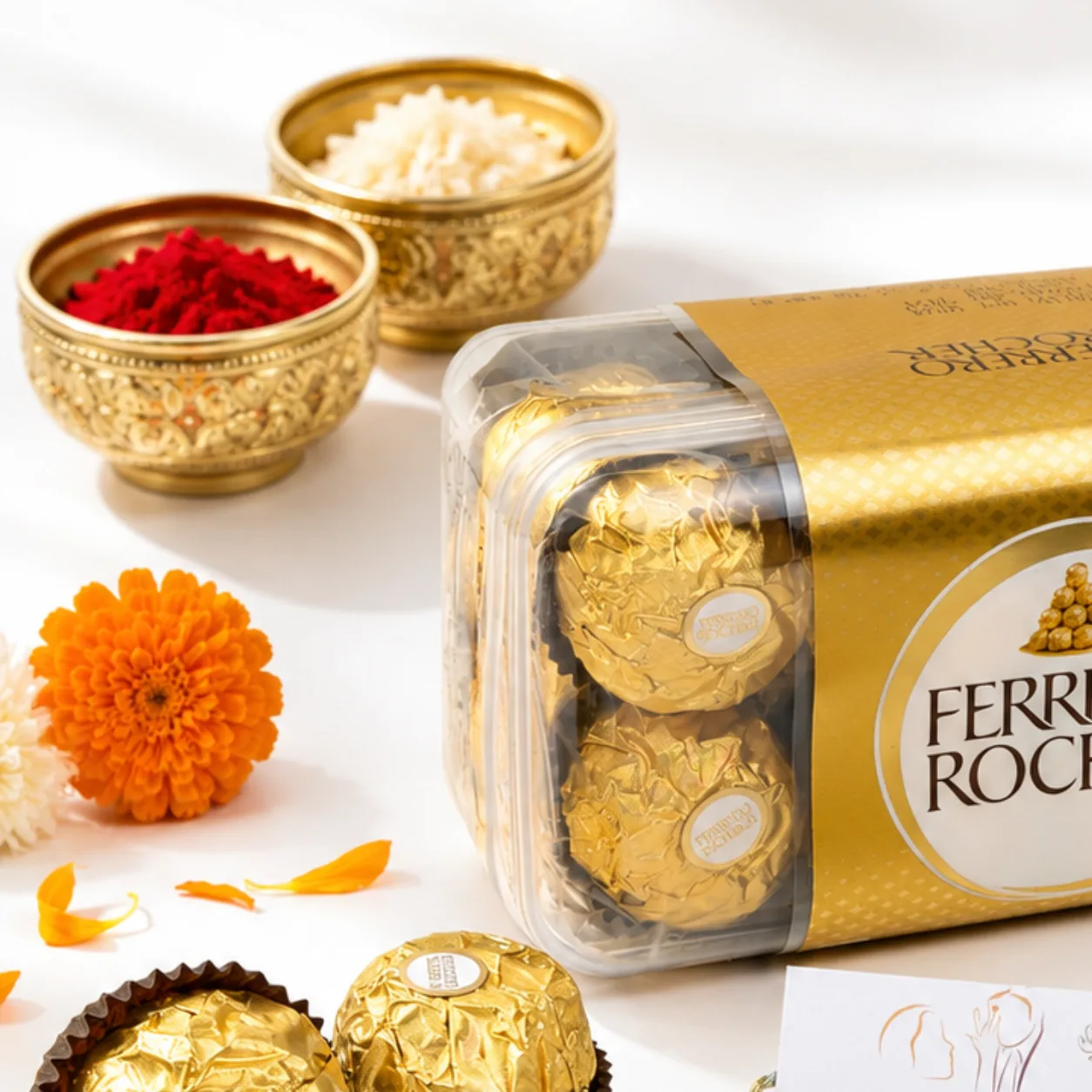 Golden Om Rakhi blessings gift set with premium Ferrero Rocher chocolates.
