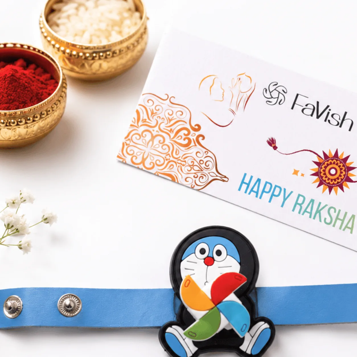 Close-up view of Doraemon Spinner Rakhi featuring a playful rotating centrepiece