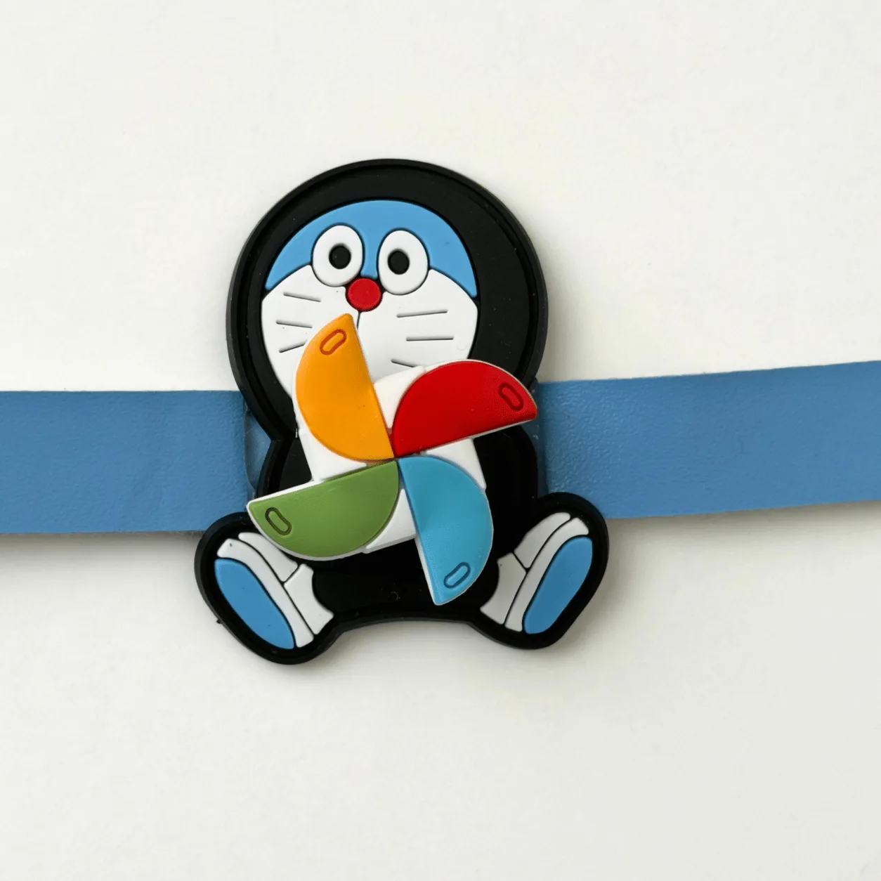 Kids Doraemon Spinner Rakhi with secure snap-button closure for Raksha Bandhan