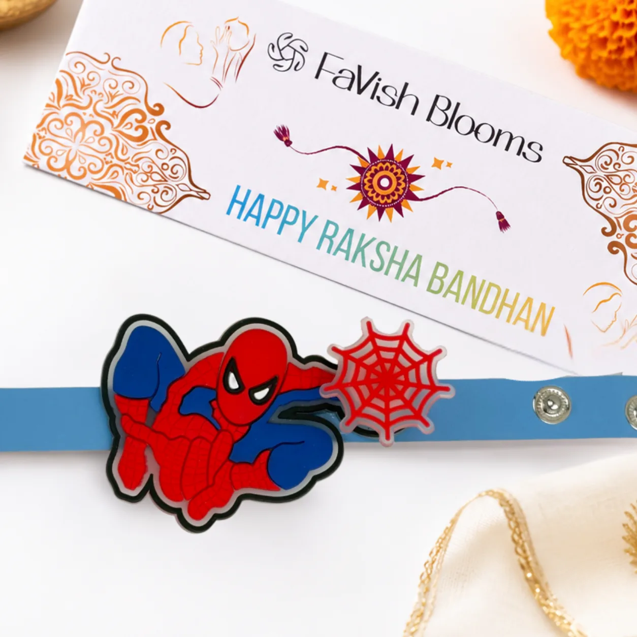 Close-up view of Spiderman Spinner Rakhi featuring a fun rotating centrepiece for kids.