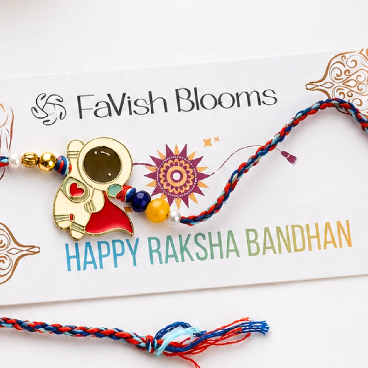 Close-up view of Astronaut Design Kids Rakhi featuring a playful 3D astronaut charm.