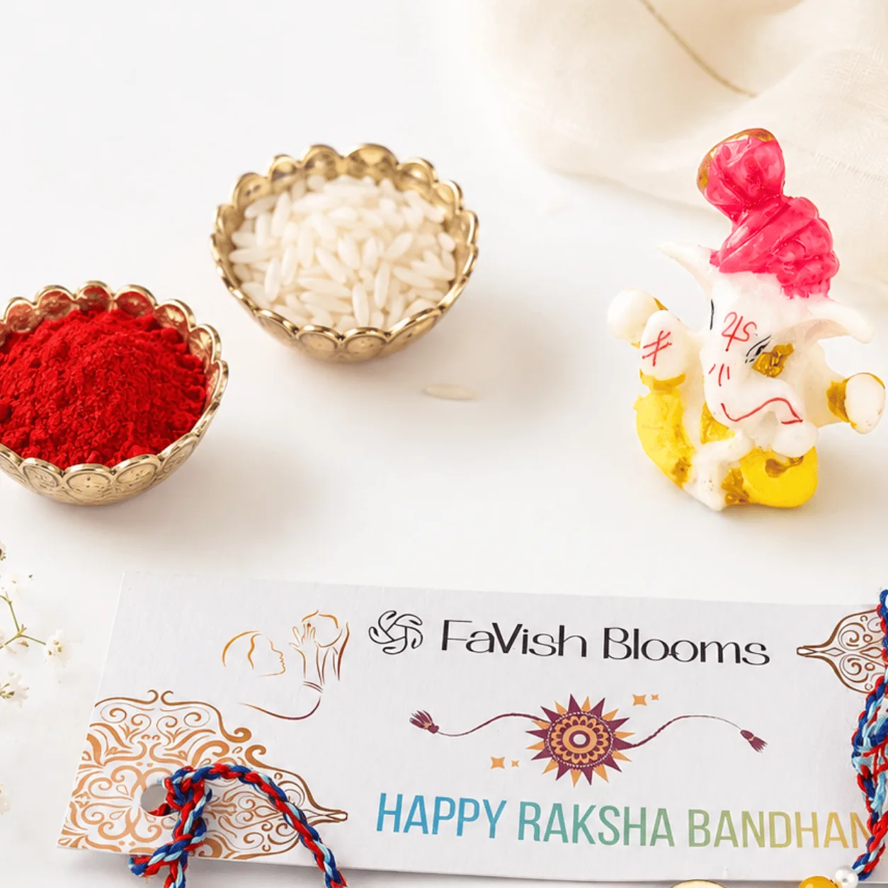 Astronaut Rakhi gift set for kids with Ganesha idol, roli, chawal, and festive card