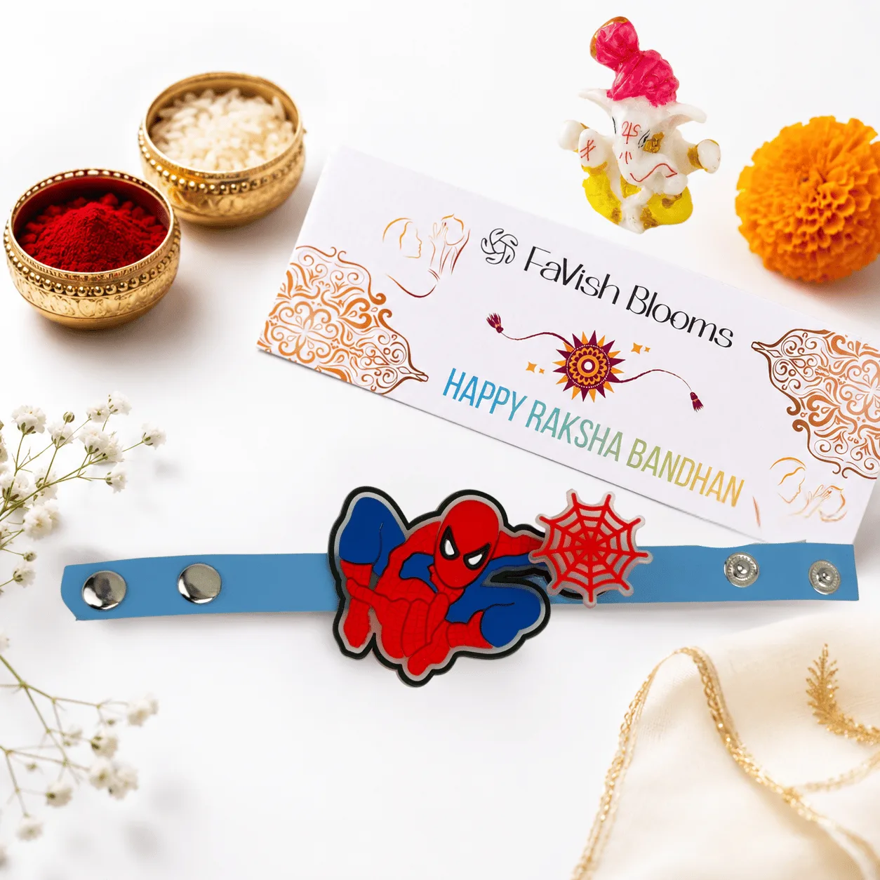 Spiderman Spinner Kids Rakhi with decorative Ganesha idol and complimentary roli chawal set.