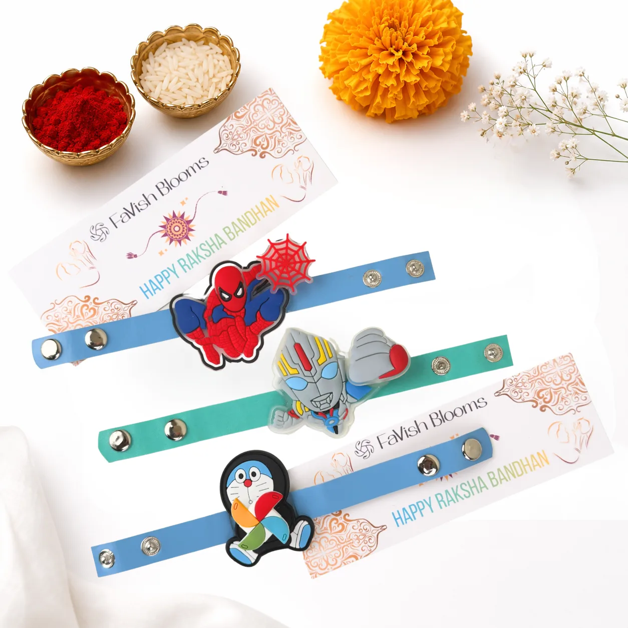 Doraemon & Superheroes Rakhi Celebration Set with Ferrero Rocher chocolates, Lord Ganesha idol, greeting card, roli and chawal by FaVish Blooms Dubai