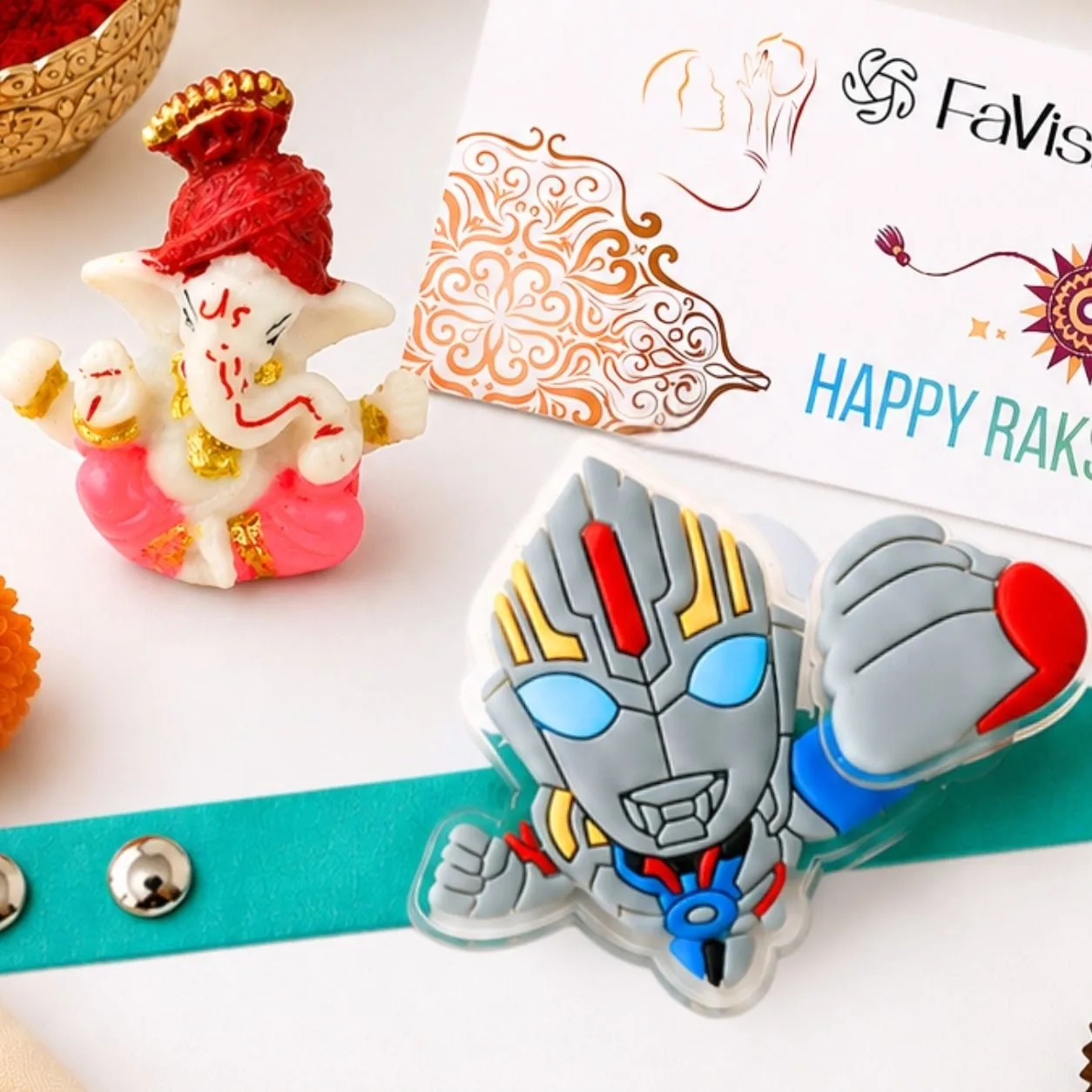 Close-up of colourful superhero kids Rakhi with chocolates and traditional Raksha Bandhan essentials.