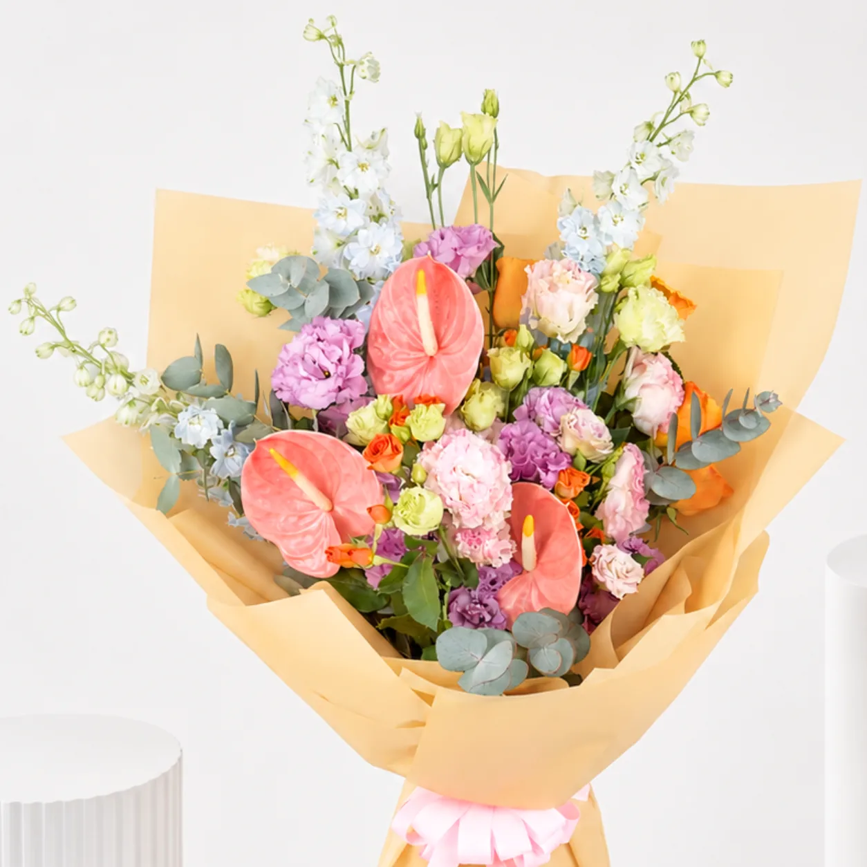 Pastel Anthurium flower bouquet with delicate seasonal flowers and premium wrapping