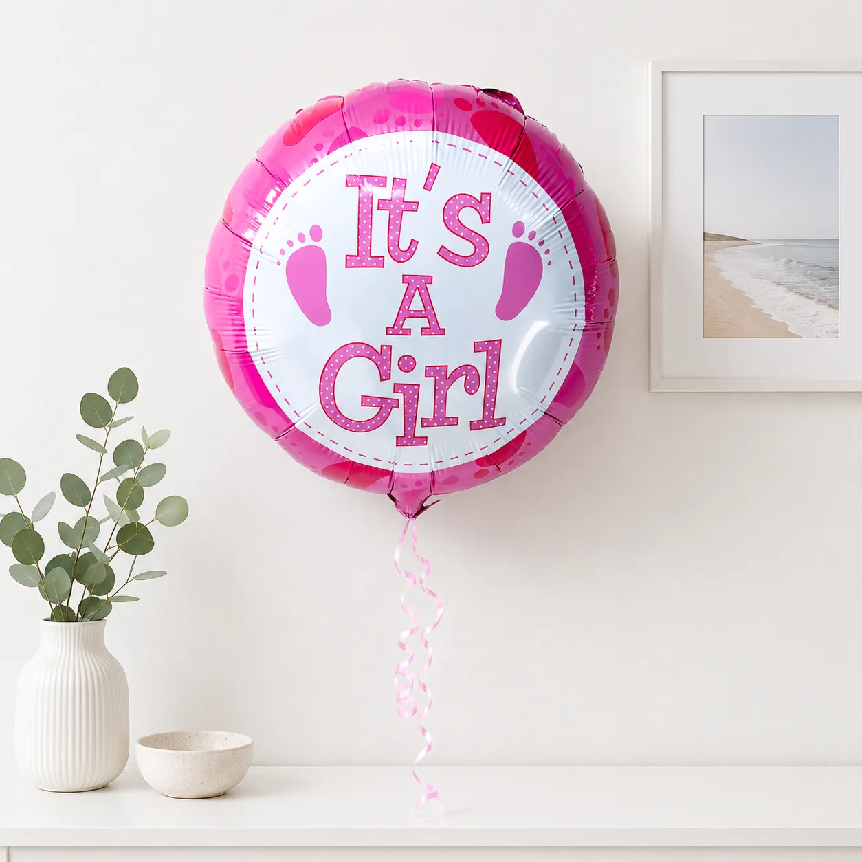 Pink helium balloon arrangement featuring It’s a Girl celebration designs