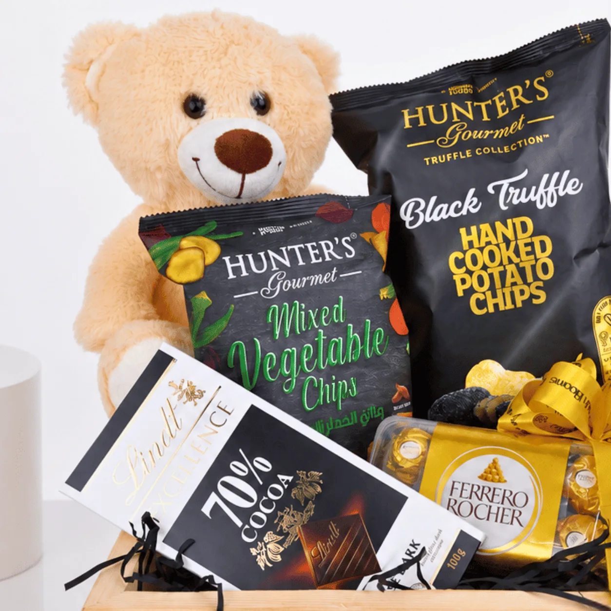 Premium snack hamper featuring Ferrero Rocher chocolates, Lindt dark chocolate and gourmet chips