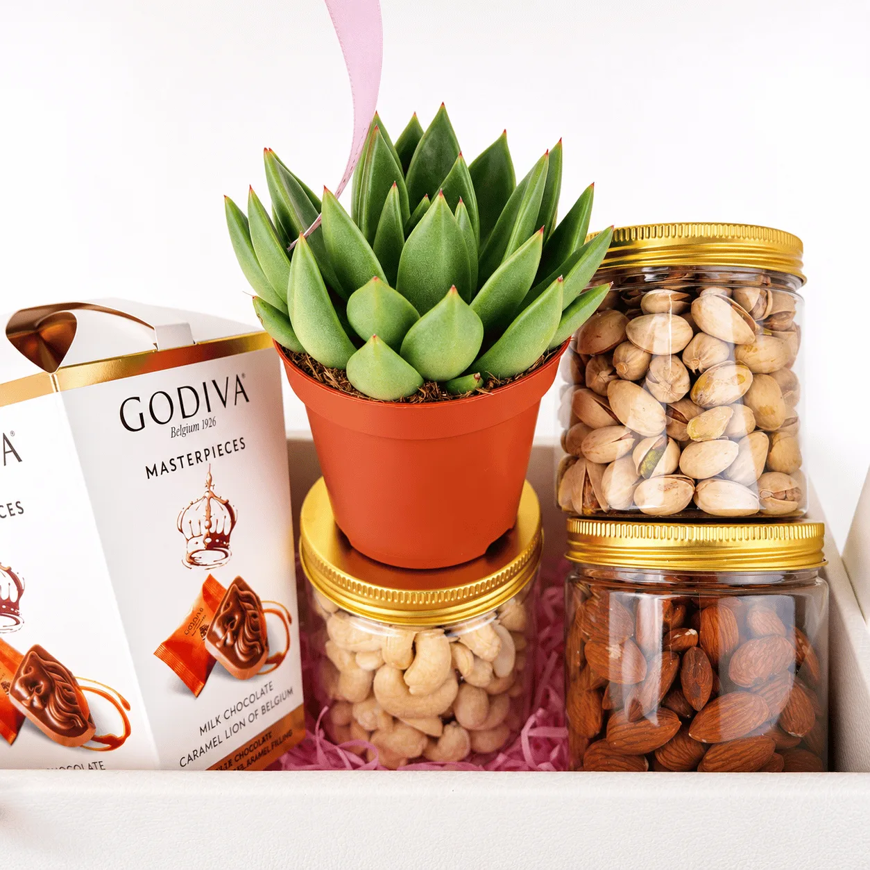 Gourmet dry fruits and Godiva chocolate gift hamper with almonds, cashews and premium treats