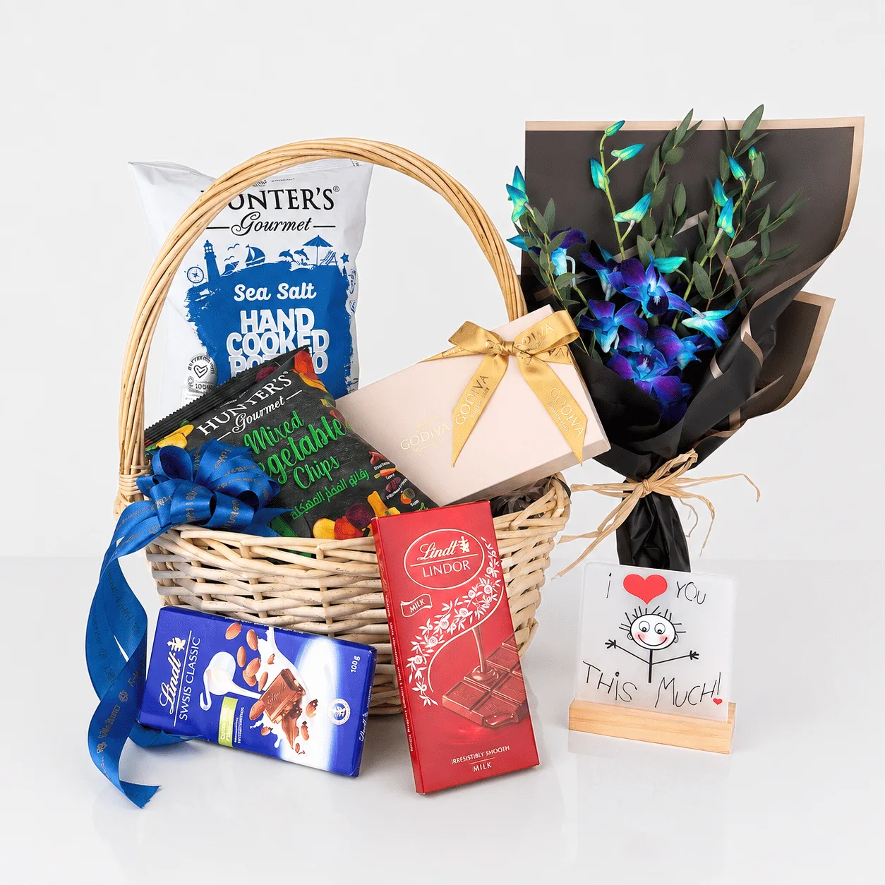 Godiva & Lindt Floral Gift Basket with premium chocolates and elegant fresh flower arrangement