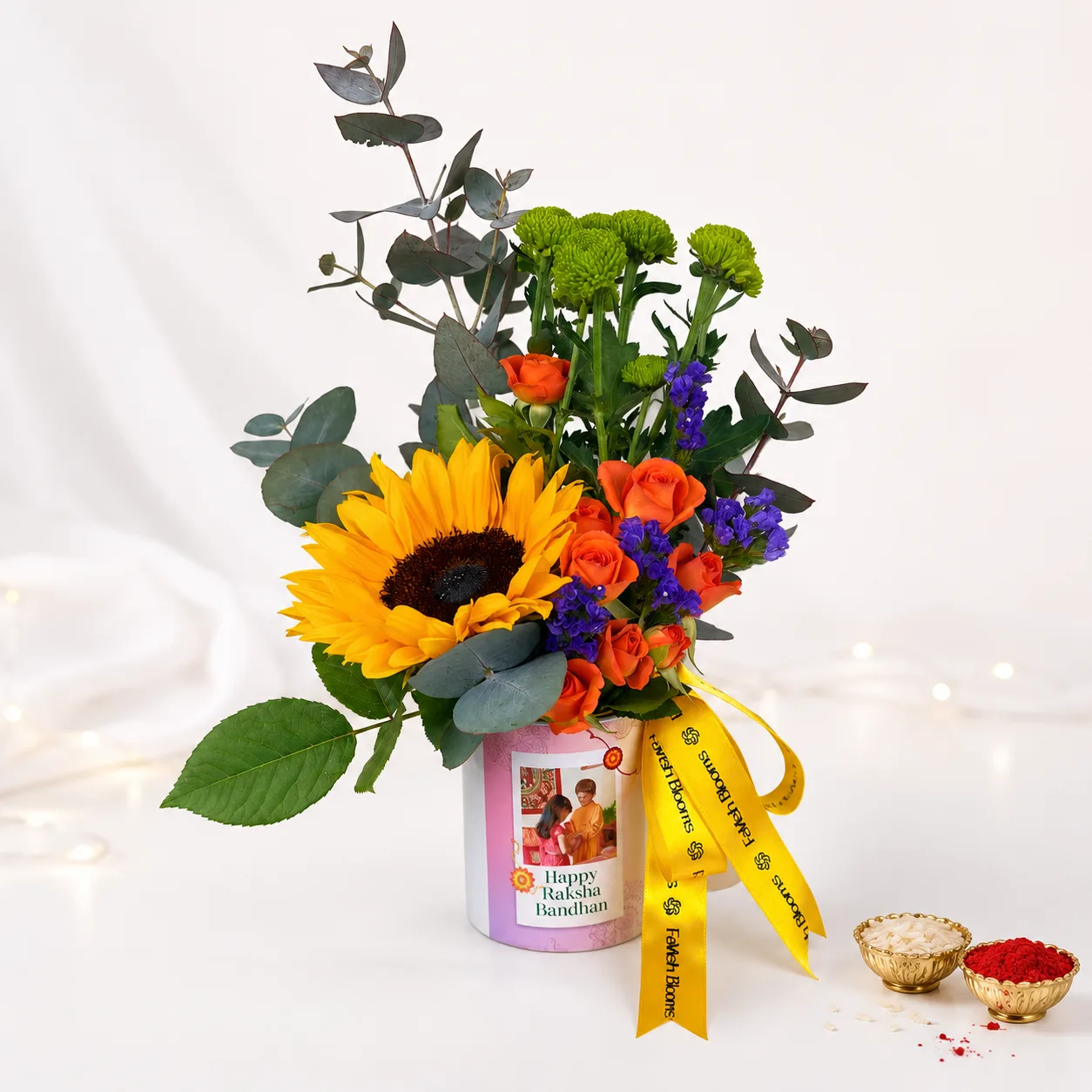 Raksha Bandhan Floral Mug with fresh flowers arranged in a festive printed ceramic mug