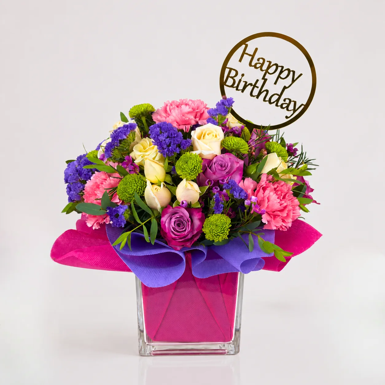 Birthday Flower Vase Arrangement with purple roses, pink carnations and peach spray roses
