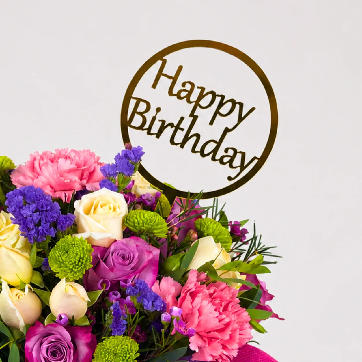 Birthday floral vase featuring purple, pink and peach flowers with Happy Birthday topper