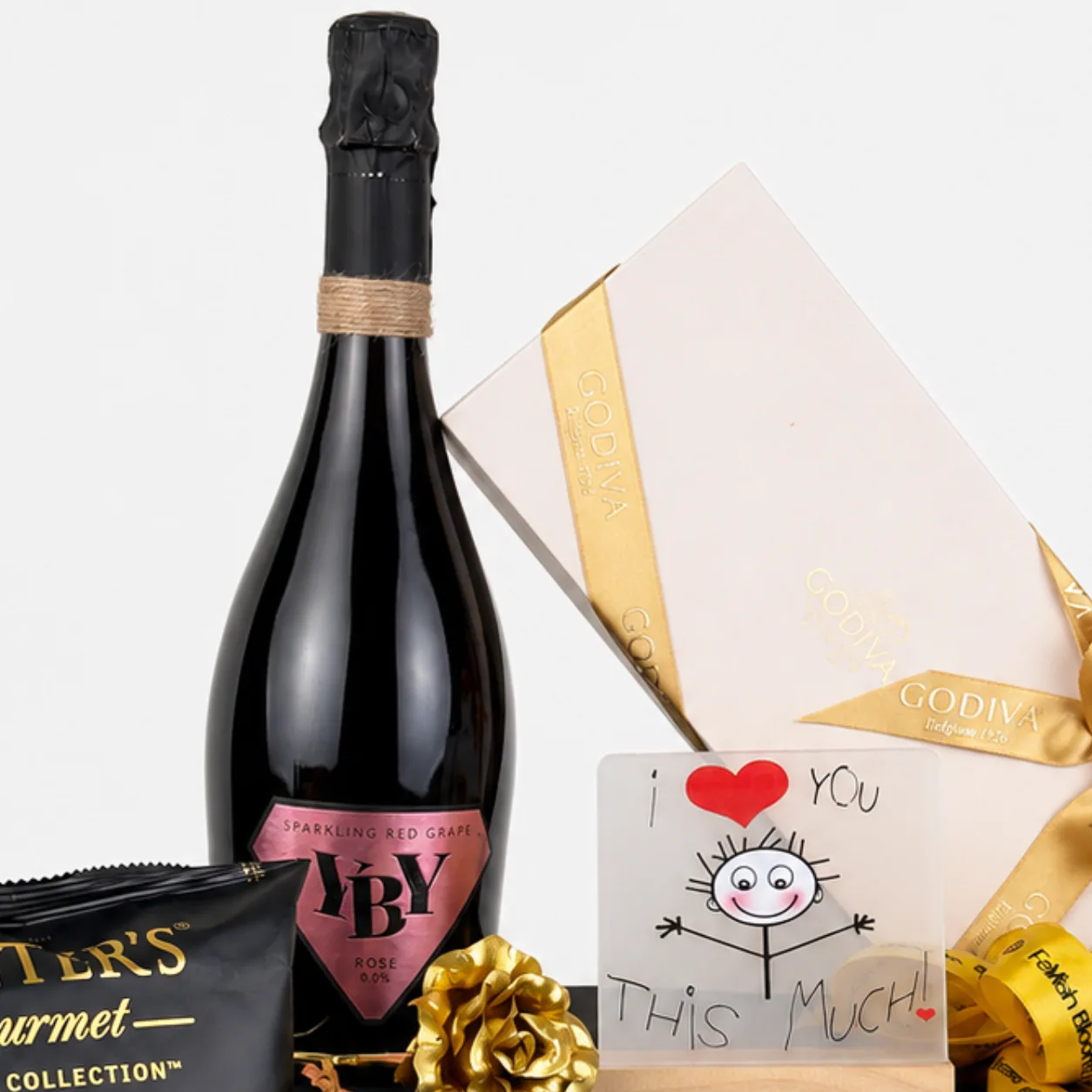 Premium Godiva chocolate hamper with sparkling beverage and thoughtful gifts