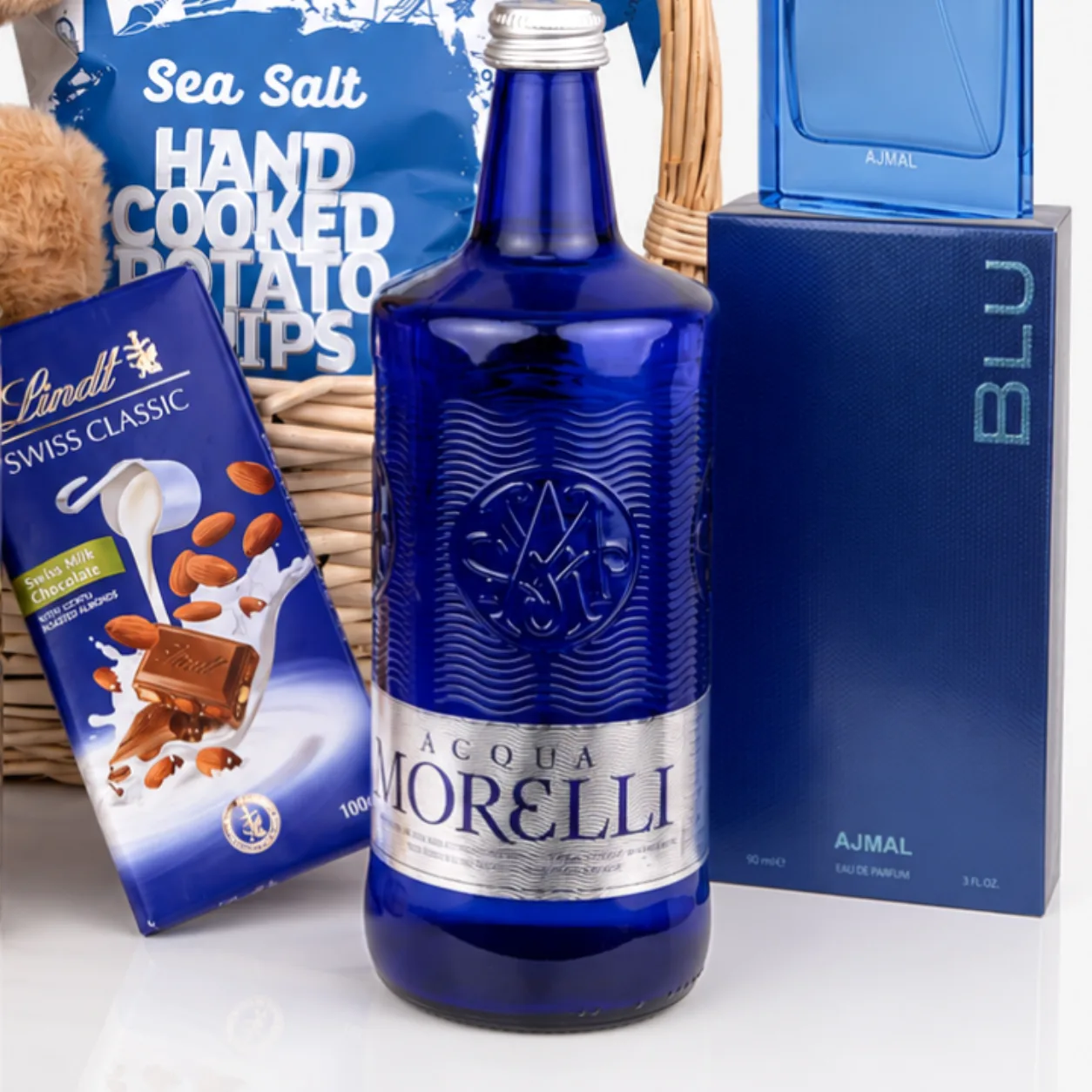 Blu Perfume & Gourmet Hamper with premium sweets, savory treats and stylish fragrance bottle