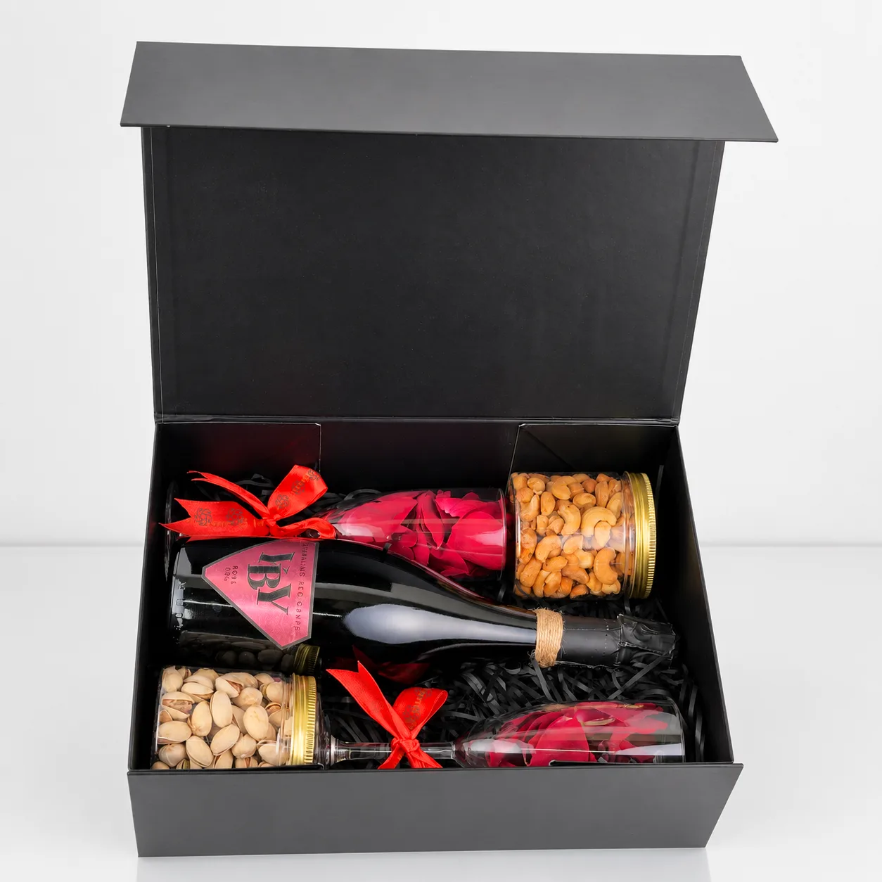 Luxury sparkling rosé gift box featuring roasted cashews, pistachios and elegant glassware