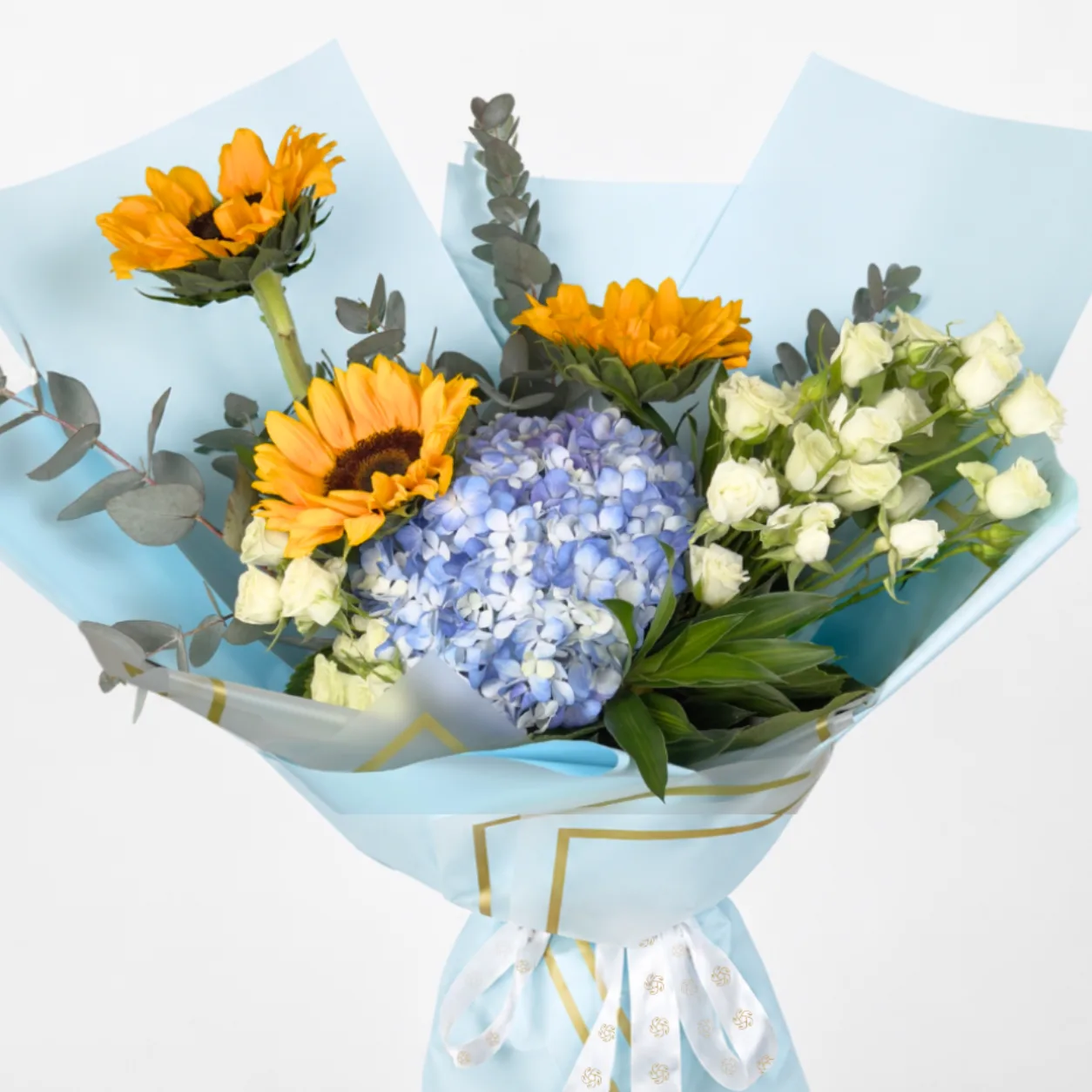 Elegant sunflower and blue hydrangea flower bouquet with fresh greenery and premium wrapping