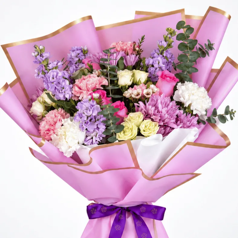 Pink & Purple Celebration Bouquet with matthiola, roses, carnations and fresh greenery