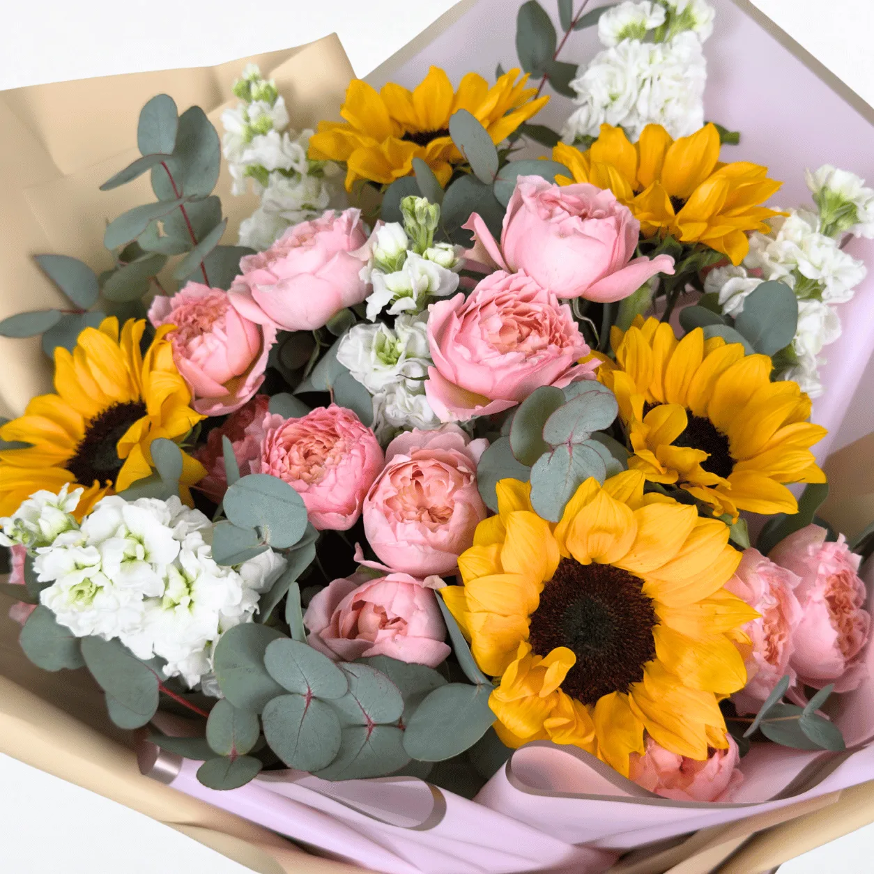 Cheerful sunflower and Juliet rose bouquet beautifully arranged for joyful celebrations and heartfelt gifting.
