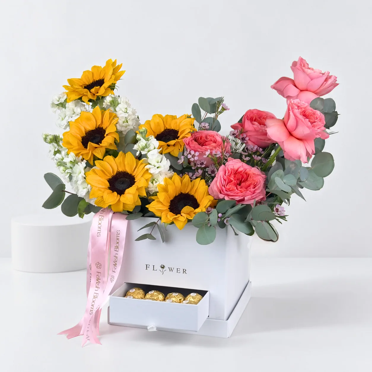 Elegant sunflower and pink O’Hara rose chocolate box for birthdays and special occasions in Dubai.