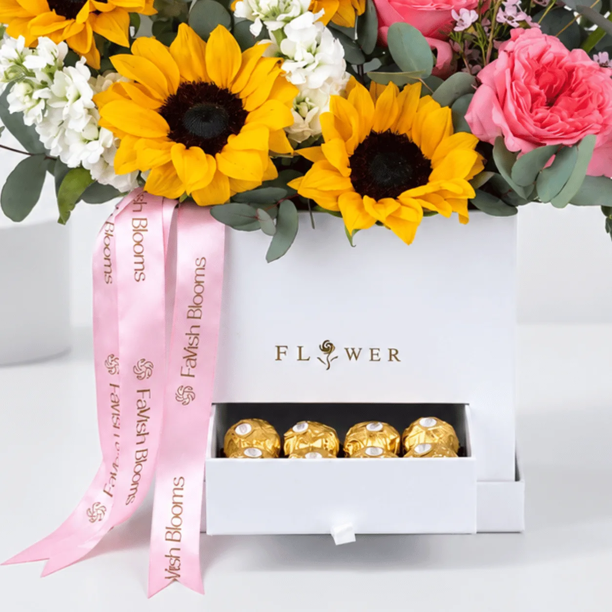 Sunflower and O’Hara rose box arrangement with Ferrero Rocher chocolates.