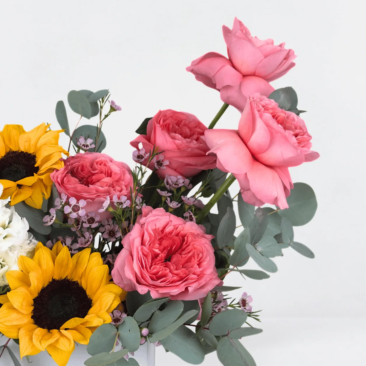 Cheerful sunflower and O’Hara rose chocolate box with Ferrero Rocher for memorable gifting in Dubai.