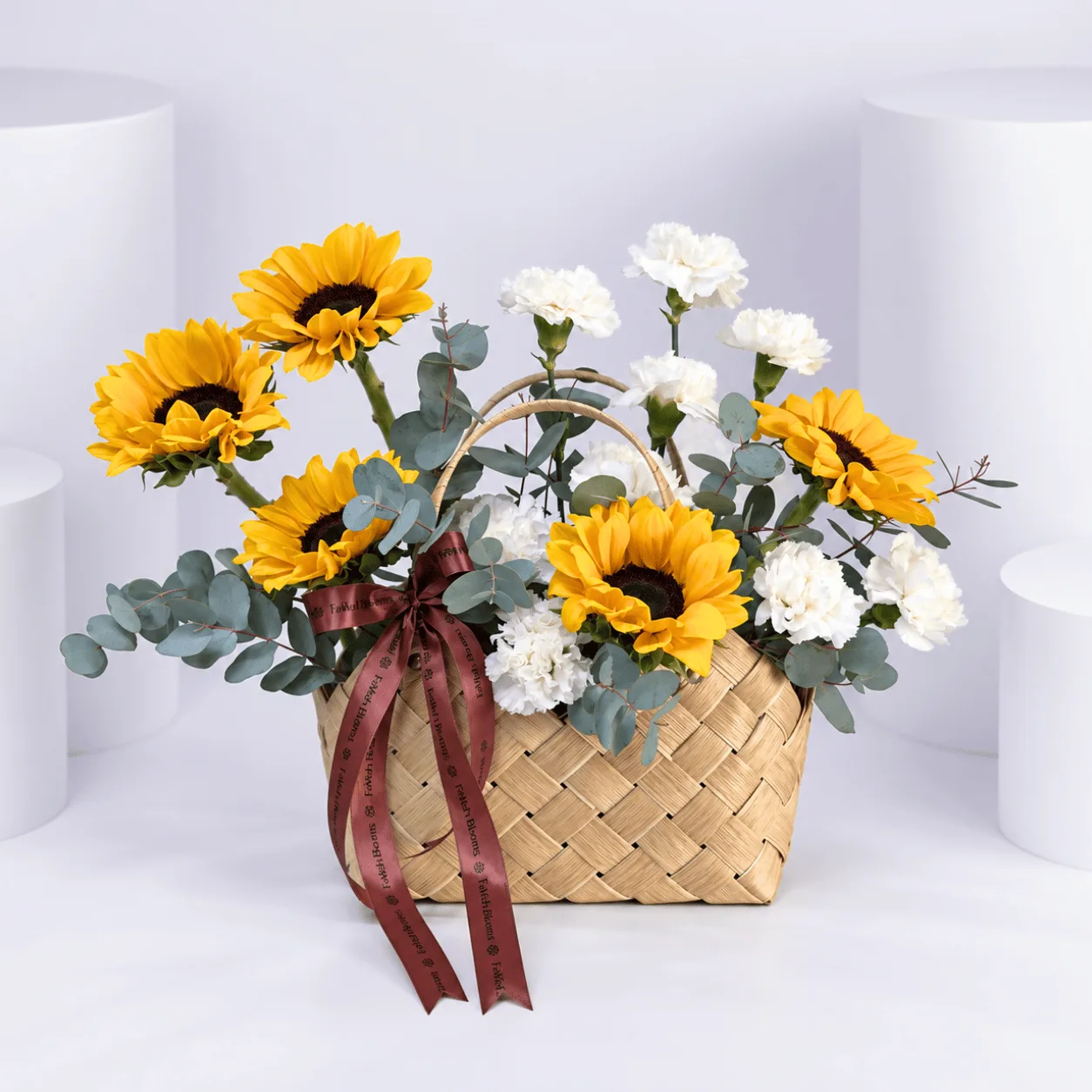 Premium Golden Hour Flower Basket with cheerful sunflowers and white carnations for flower delivery in Dubai.
