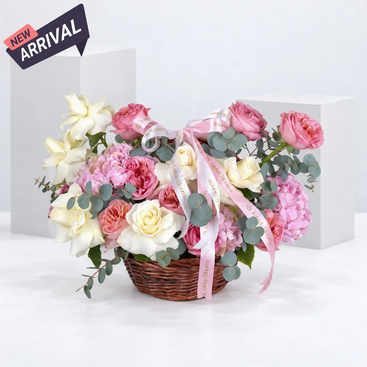 Premium pastel flower basket featuring fresh pink garden roses, ivory roses and soft pink hydrangeas for birthdays and anniversaries.