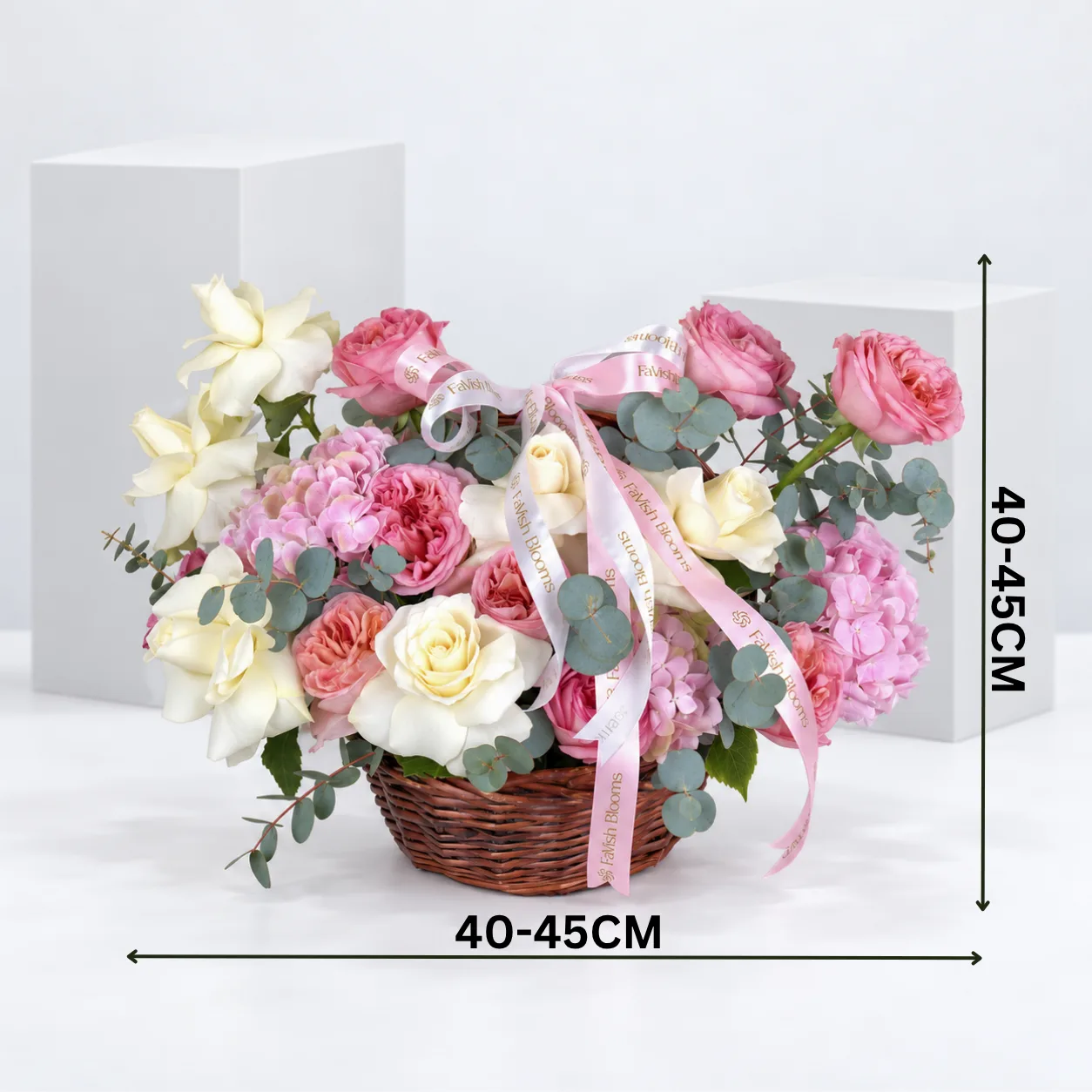 Luxury pink and white rose flower basket with delicate hydrangeas, arranged in an elegant dark brown wicker basket