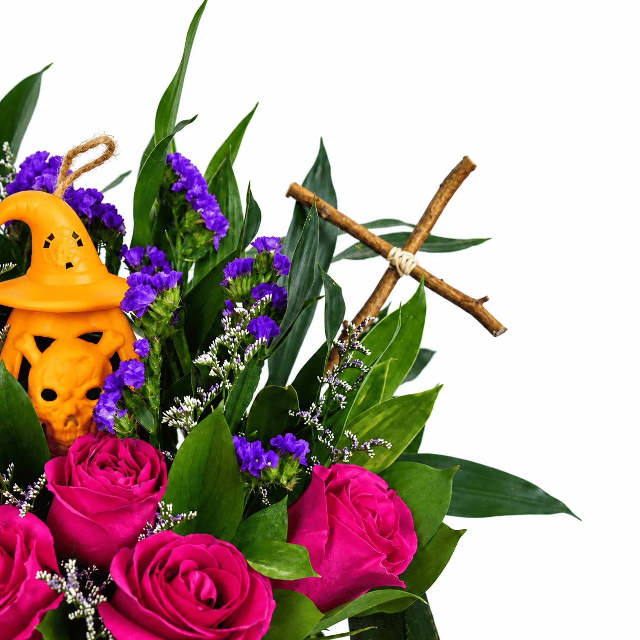 Elegant Halloween pink roses flower arrangement in a decorative bucket with creepy skeleton accents and festive details.