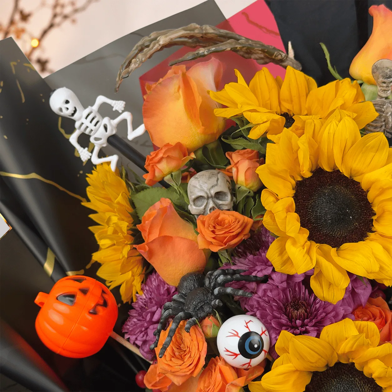Close-up of Pumpkin Magic Halloween Flower Bouquet showcasing beautiful seasonal blooms, rich autumn colors, and festive floral details.