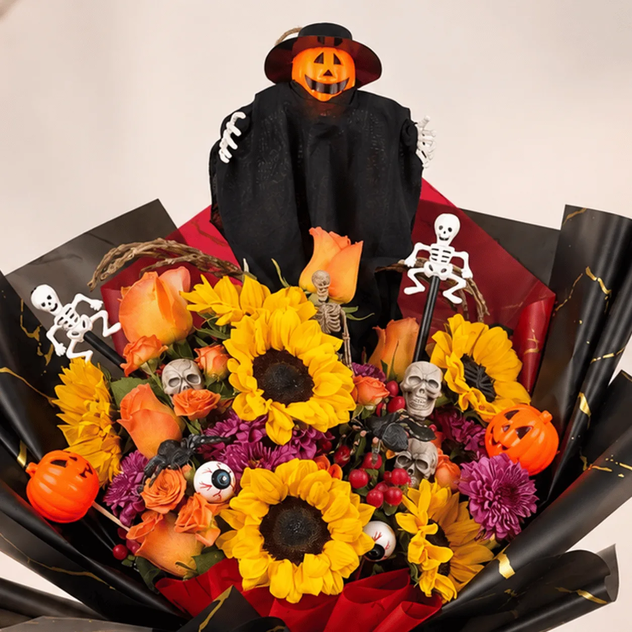 Side view of Pumpkin Magic Halloween Flower Bouquet highlighting its elegant floral arrangement and charming Halloween-inspired design.