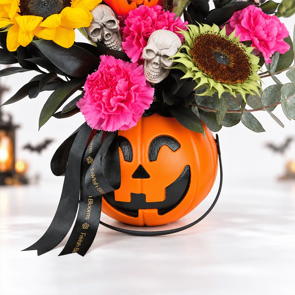 Close-up of Pumpkin Magic Halloween Floral Arrangement highlighting fresh blooms, rich autumn colors, and Halloween decorations.